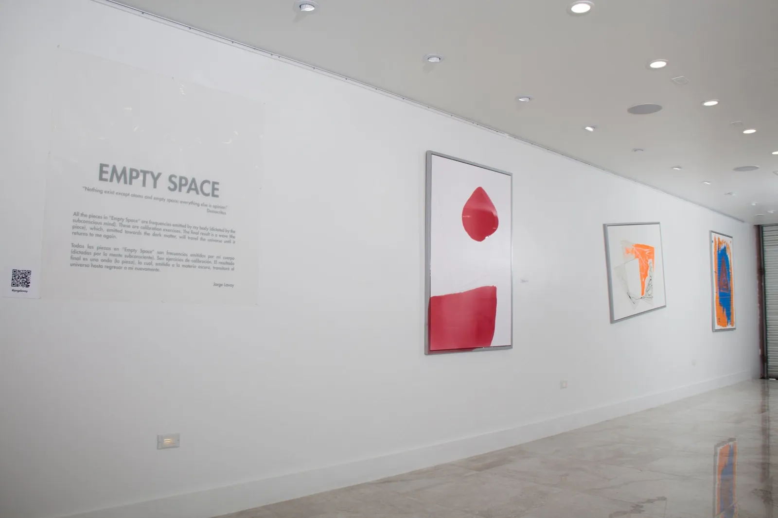 Empty Space title wall with exhibition text and three large wall works