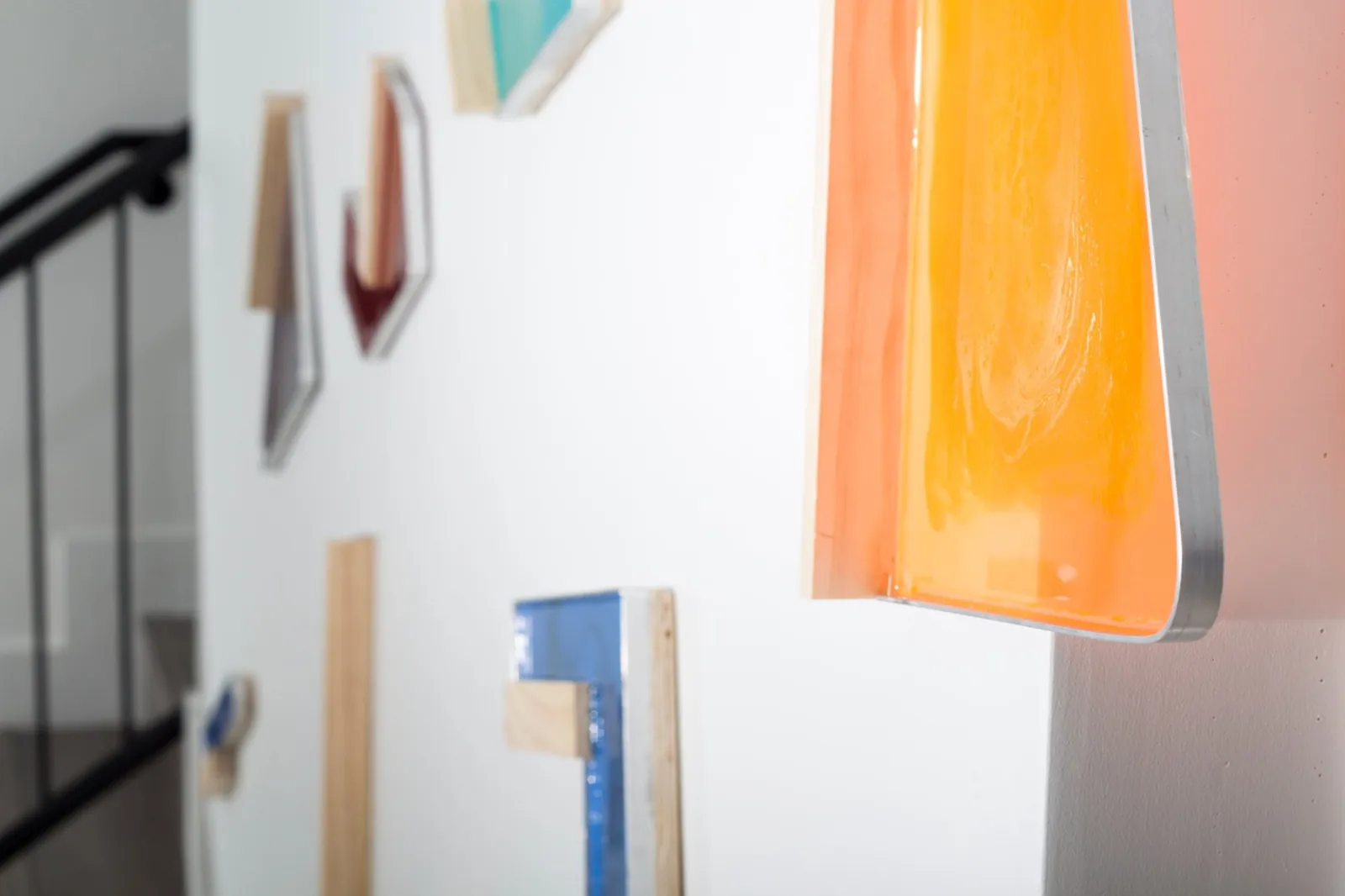 Detail of Thoughts, orange pigmented resin shape with aluminum edge